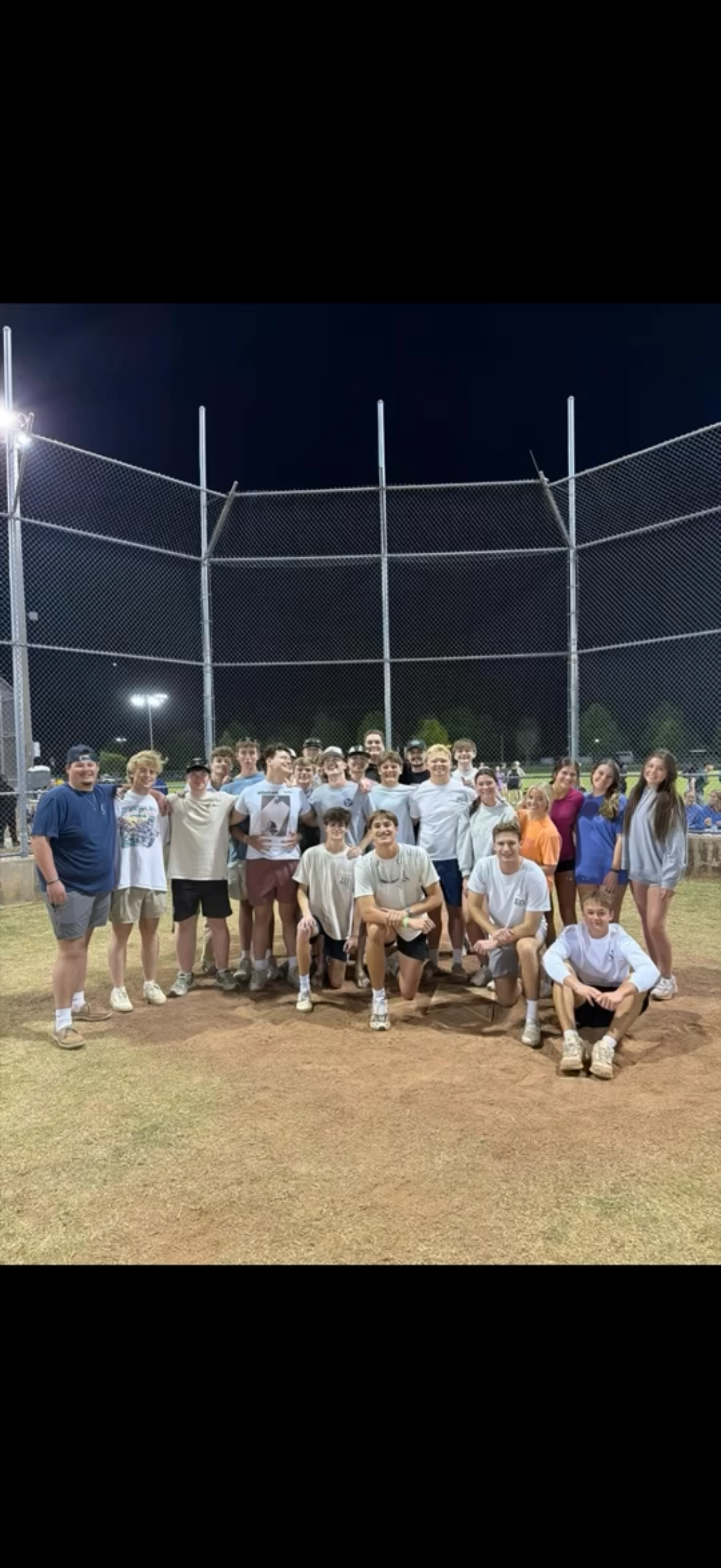 Brothers and friends together at an intramural field