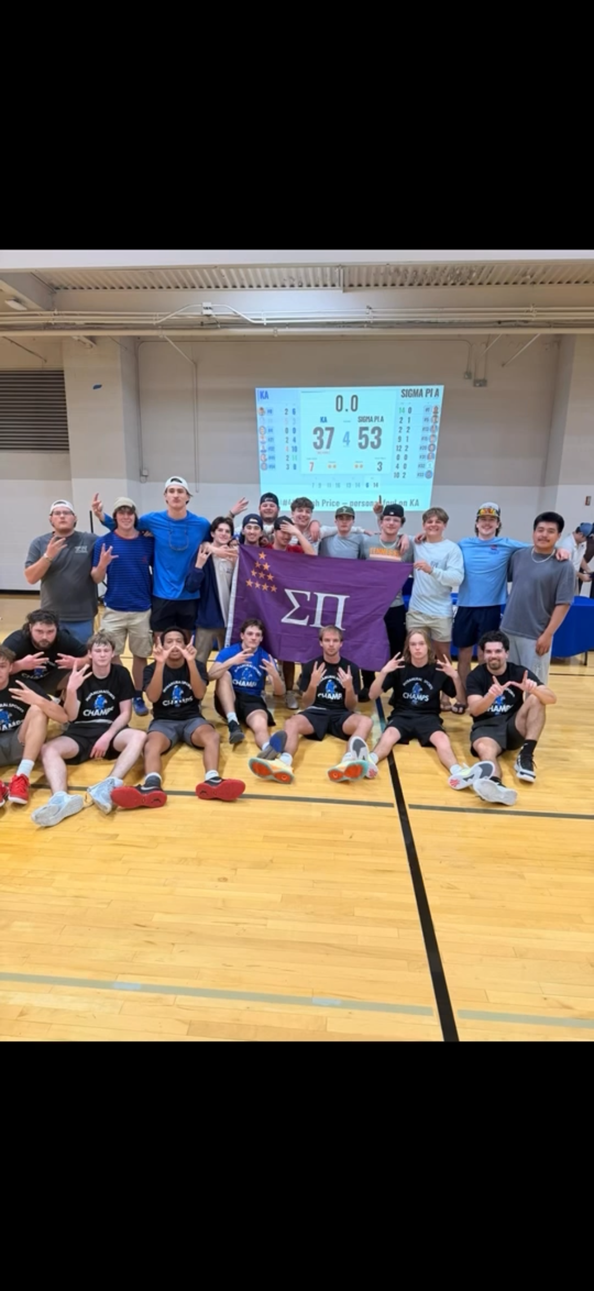 Sigma Pi intramural champions with the chapter flag